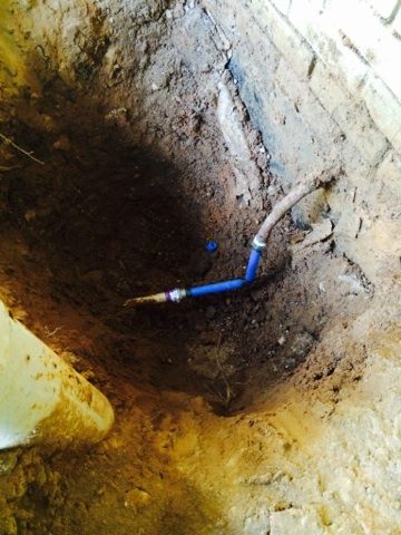Broken Water Line Next To A House