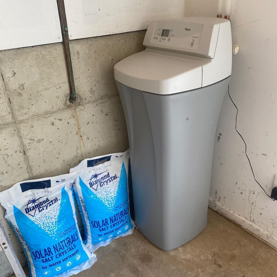 The softener connected to the water line, ready to use