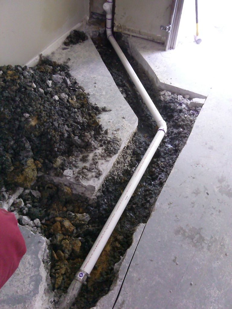 The new PVC drain in the trench