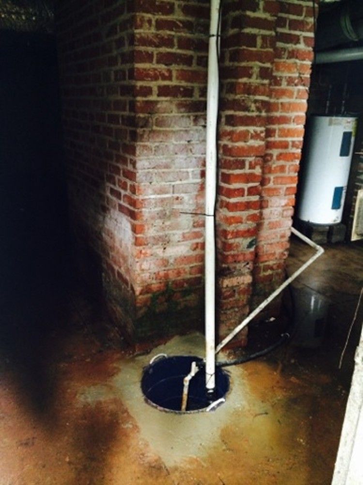 The finished sump pump with its discharge line