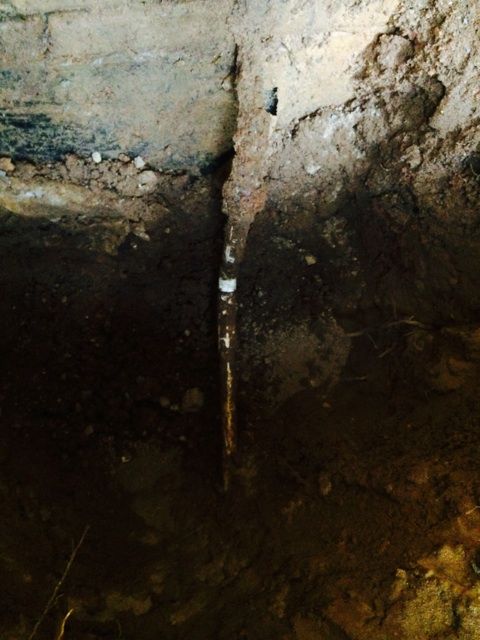 The old line along the foundation before the repair