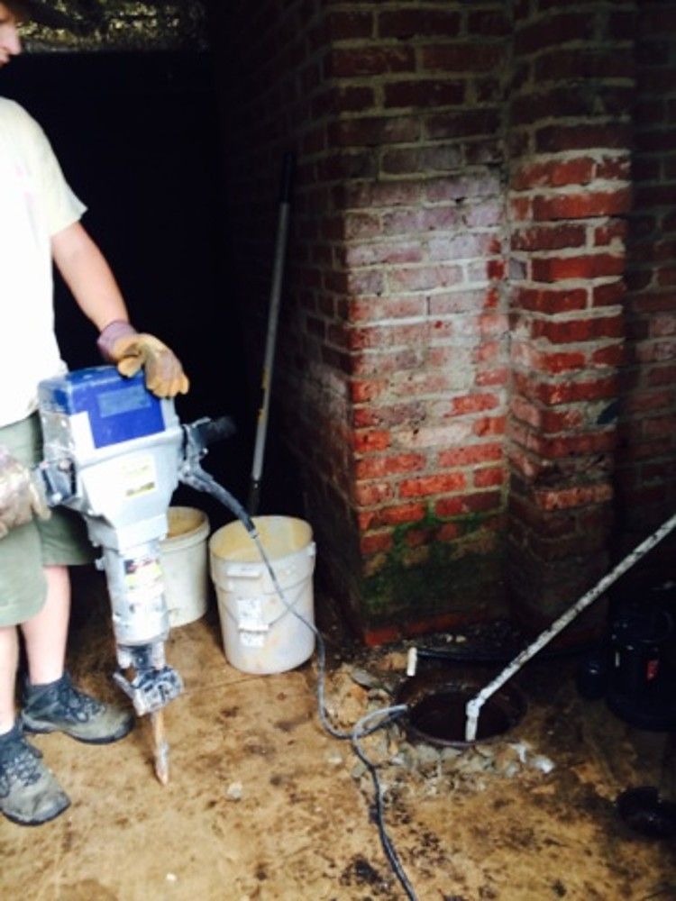 Breaking up the basement floor for the pit