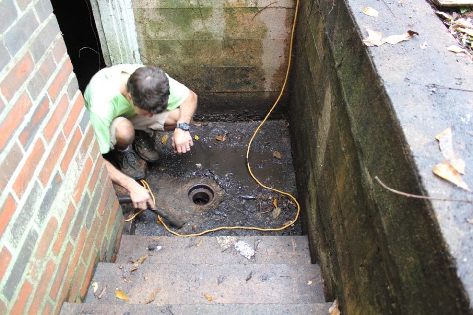The drain in the outside basement stairwell